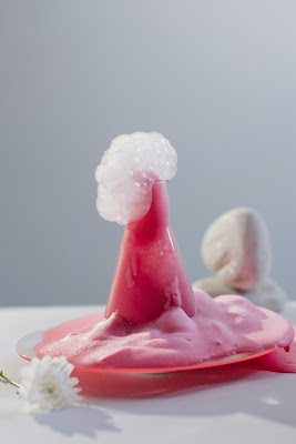 DIY SCIENCE EXPERIMENTS Mix baking soda and vinegar to create a bubbly volcano!