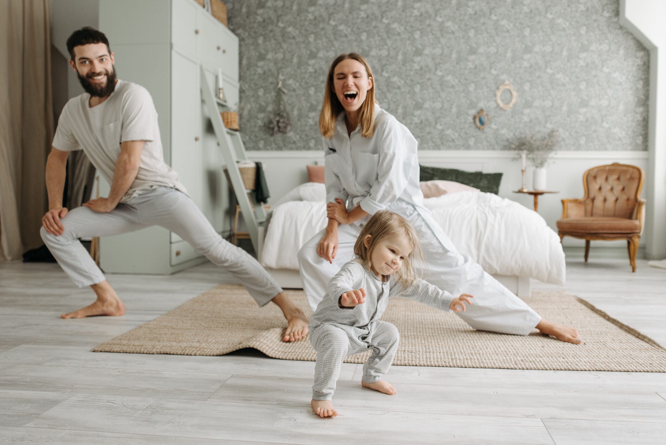 parents with some playful movements as a family